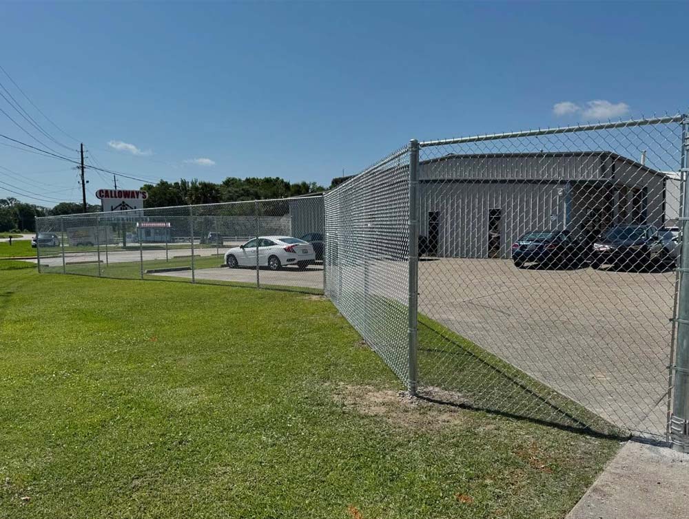 Commercial chain link fence surrounding a business property in Baton Rouge