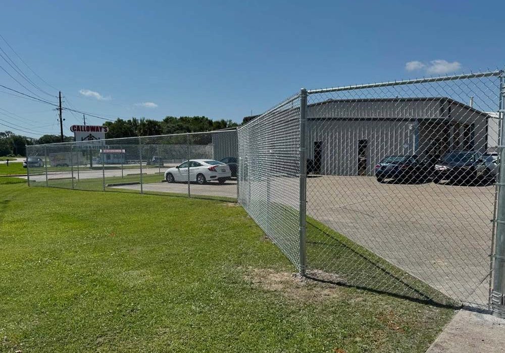 Commercial chain link fence surrounding a business property in Baton Rouge