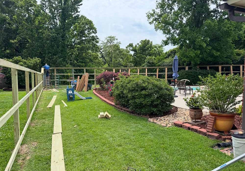 New wooden fence installation